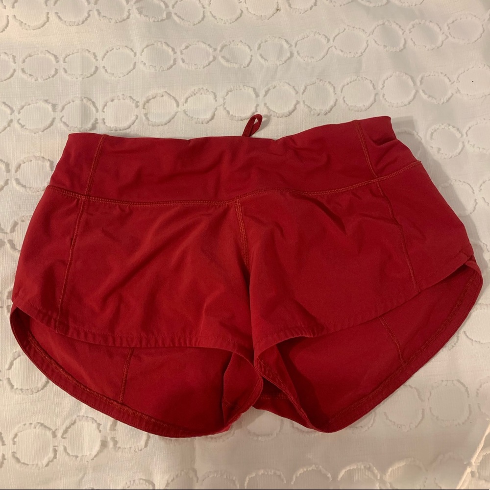 red Lululemon shorts, size 2